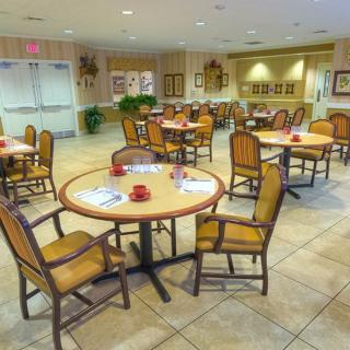 A well-arranged dining area with tables and chairs set up for guests.