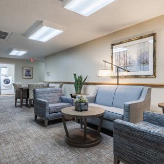 A cozy waiting room with comfortable seating and modern decor.