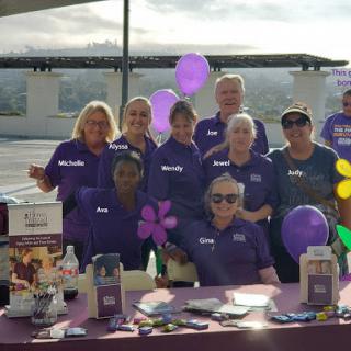 A group of dedicated individuals at a community event, showcasing their teamwork and enthusiasm.