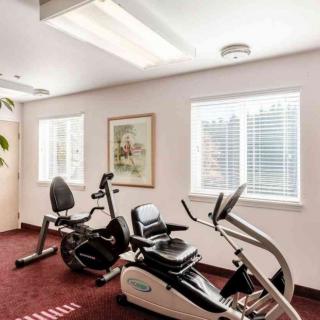 A small fitness room with stationary bikes and exercise equipment.