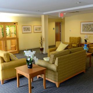 A cozy waiting area with comfortable seating and warm decor.