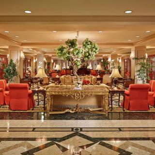 A luxurious hotel lobby with elegant furniture and decorative elements.