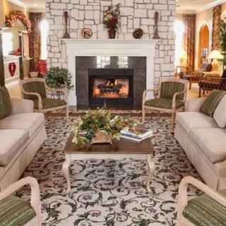 Cozy living room with a fireplace and classic furniture arrangement.