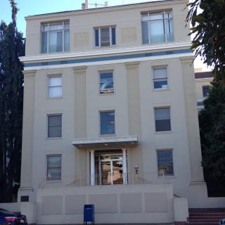 A multi-story residential building with a classic architectural design.