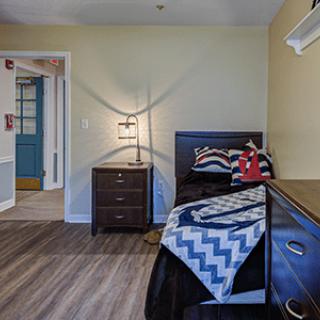 A cozy bedroom with modern furniture and stylish decor.