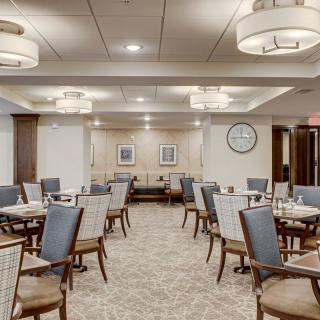 A well-lit dining area with elegant furnishings and dcor.
