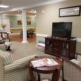 A cozy living area with comfortable seating and a television.