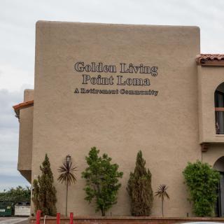 Exterior of a building with a sign reading 'Golden Living Private Library & Professional Development'.