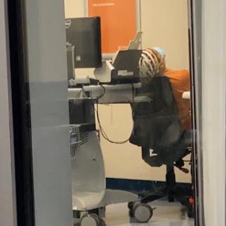 A glimpse into a modern office workspace featuring a computer desk and ergonomic chair.