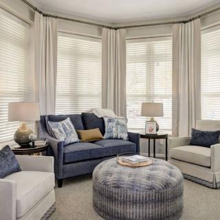 A cozy living room with comfortable seating and elegant decor.