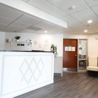 A modern reception area featuring sleek design and comfortable seating.