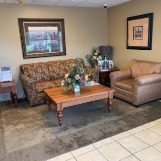 A cozy lobby area featuring comfortable seating and tasteful decor.
