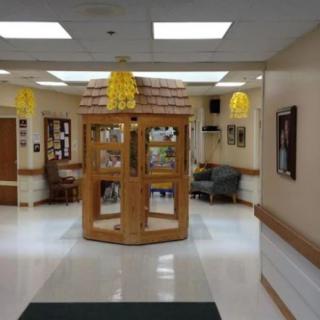 A well-lit lobby area with seating and decorative elements.