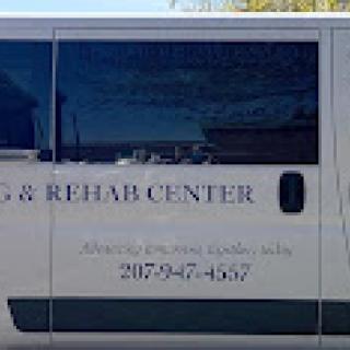 A van from a rehabilitation center, providing essential transportation services.