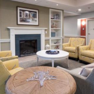 A cozy living room with comfortable seating and a fireplace.