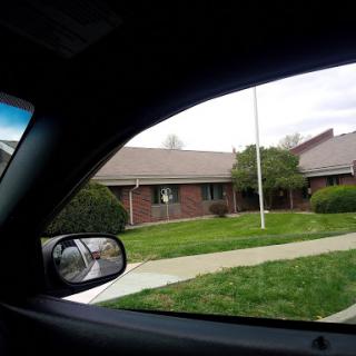 A view of a residential area from inside a car.