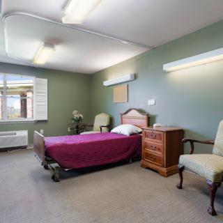 A simple and serene hospital room designed for patient recovery.