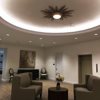 A modern lobby interior with comfortable seating and stylish lighting.
