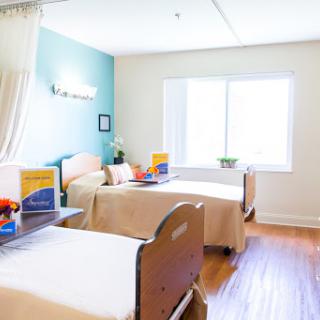 A bright and welcoming patient room in a healthcare facility.