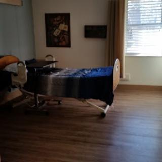 A quiet hospital room featuring a hospital bed and minimal decor.