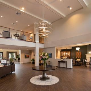 A modern and spacious lobby with stylish lighting and comfortable seating.