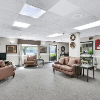 A spacious lobby with comfortable seating and decorative elements.