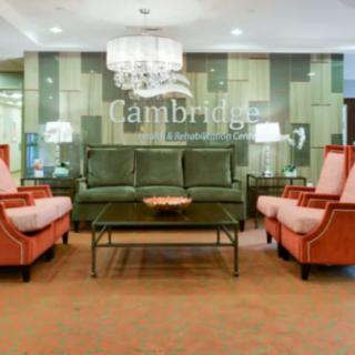A luxurious hotel lobby with elegant seating arrangements and a chandelier.