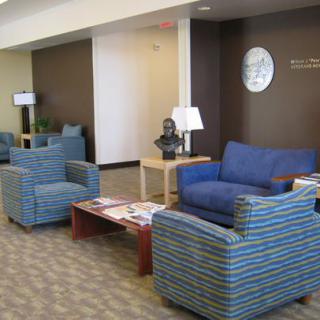A well-furnished waiting area with comfortable seating and modern decor.