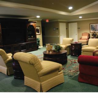 A cozy living room featuring comfortable seating and a central coffee table.