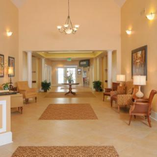 A spacious and elegantly designed lobby with comfortable seating and ambient lighting.