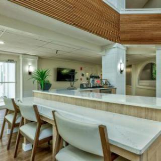 Modern dining area with wooden accents and contemporary decor.