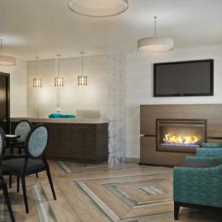 A modern living room with a cozy fireplace and stylish furniture.