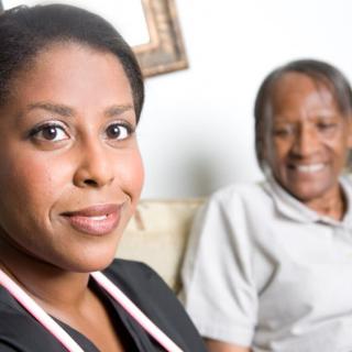 A healthcare professional with a patient, showcasing caregiving and support.