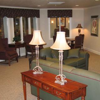 A cozy living room with elegant lamps and comfortable seating.