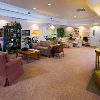 A spacious living room with comfortable seating and ample natural light.