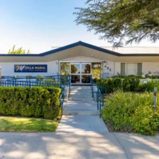 Front entrance of a healthcare clinic with well-maintained landscaping.