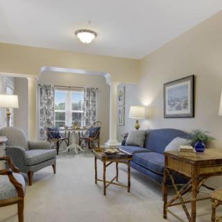 A cozy living room with comfortable furniture and warm lighting.