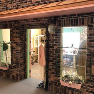 A charming storefront with a cozy entrance and decorative displays.