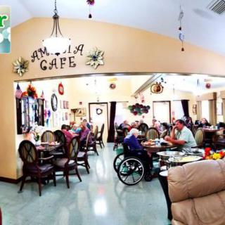 A cozy cafe interior with people dining and enjoying the welcoming atmosphere.