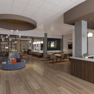 A modern lobby with stylish furnishings and an open seating area.