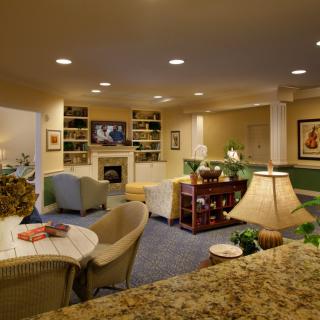 Cozy living room with a fireplace and comfortable seating arrangement.