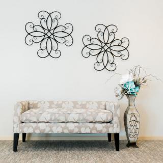 Modern interior with decorative wall art and a cozy bench.