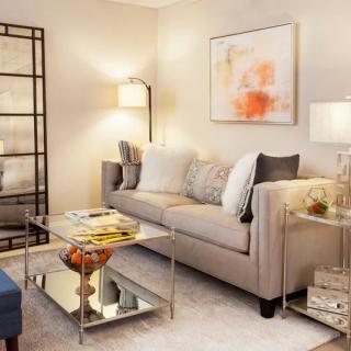 A cozy and modern living room with a neutral palette and stylish furnishings.