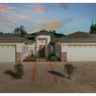A suburban house with dual garages, captured during sunset.