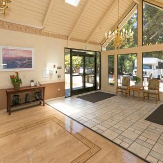 Bright and welcoming lobby with large windows and natural light.