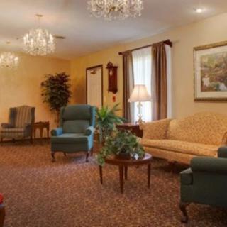 A cozy living room interior with elegant lighting and classic furniture.