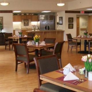 An empty dining area with neatly set tables and chairs.