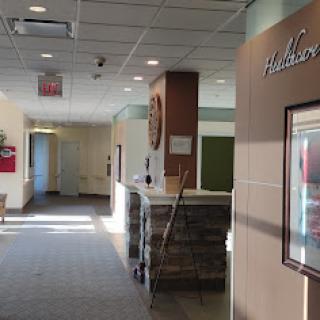 A well-lit hallway showcasing a modern reception area.