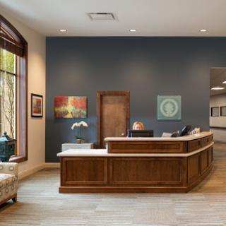 A modern reception area showcasing elegant design and contemporary artwork.