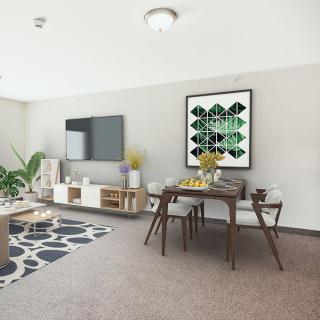 A modern living room with a dining area, featuring stylish furniture and artwork.